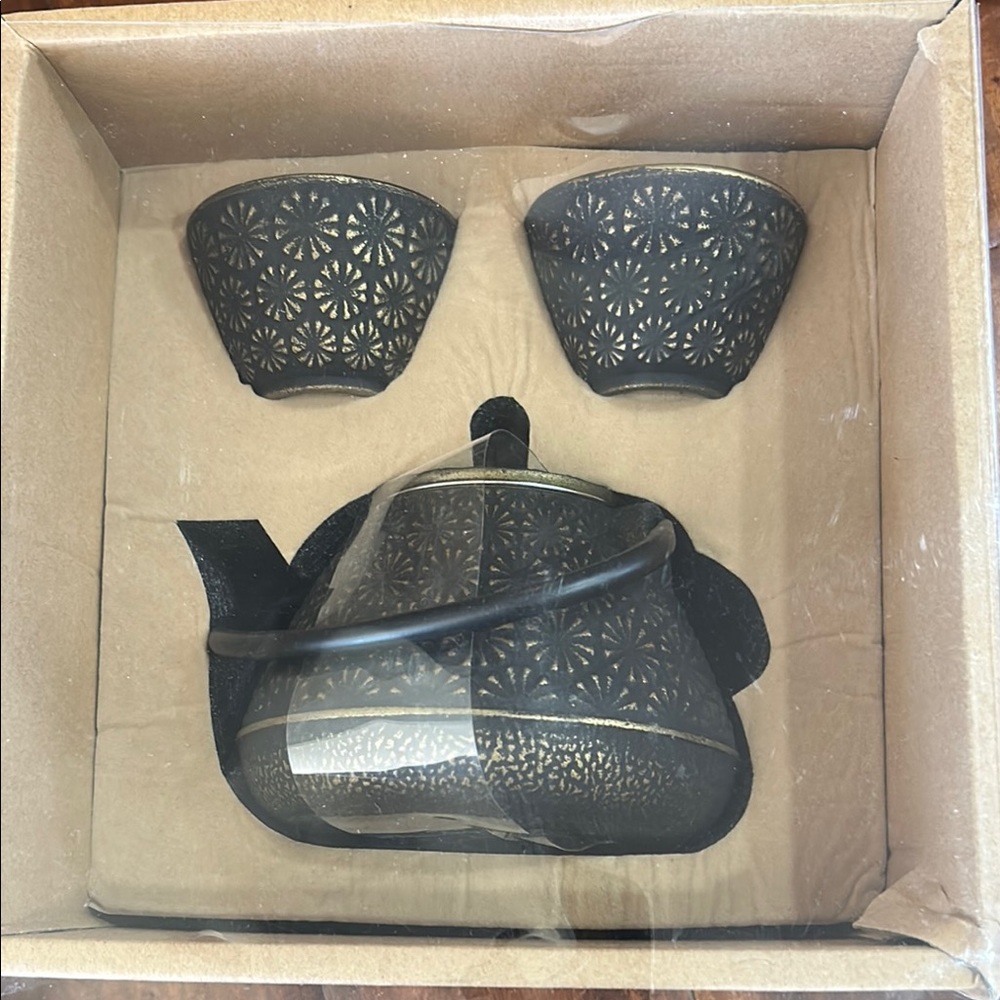 Elegant Black Cast Iron Teapot Set with Floral Design—